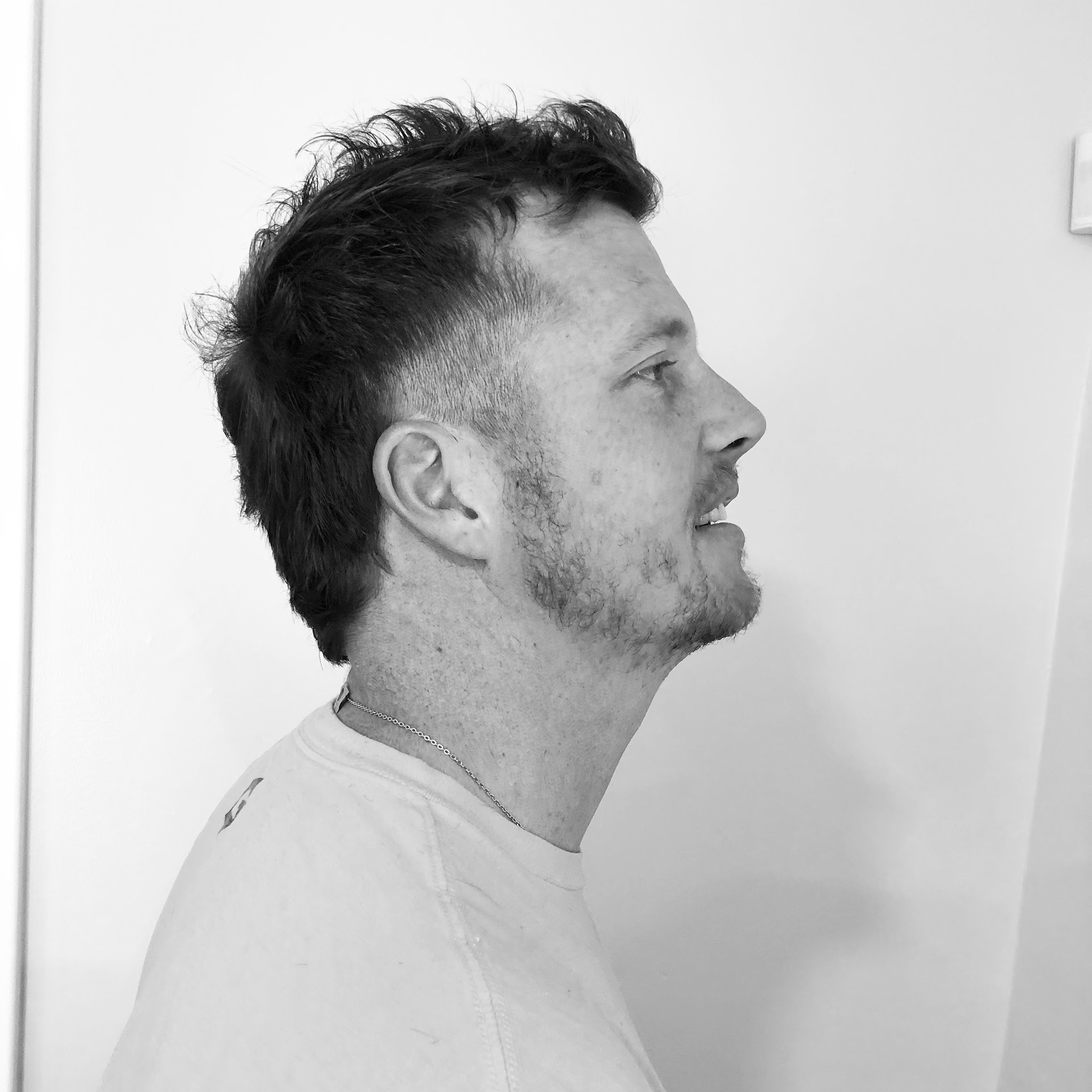 Black and white photo of a man's textured cut